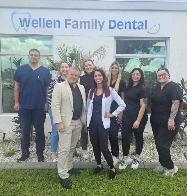 Wellen Family Dental team photo outside their North Port, FL office